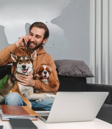 Dog owner spending time with their Labrador